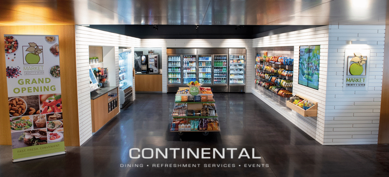 A modern self-serve market by Northern Vending Company features shelves of snacks, drinks, and fresh foods, shiny floors, clean design, refrigerators in the back, and a “Grand Opening” sign on the left.