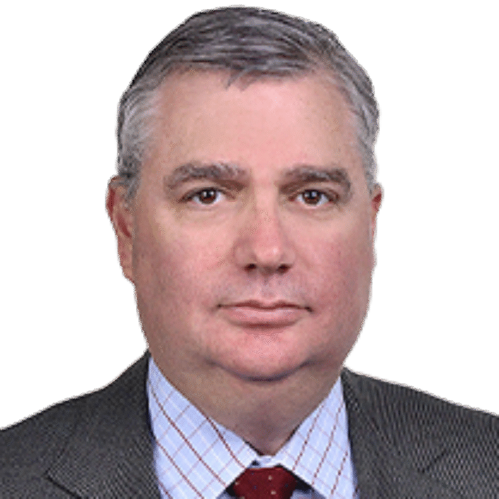 A middle-aged man with short gray hair, wearing a gray suit, light blue checkered shirt, and red polka dot tie, poses against a plain white background—professional attire typical of a Houlihan Lokey financial advisory expert.