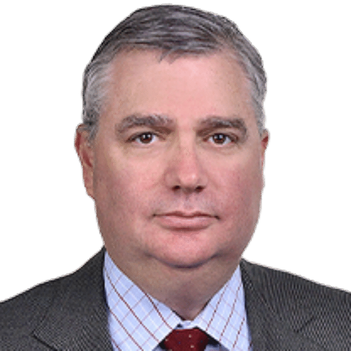 A middle-aged man with short gray hair, wearing a gray suit, light blue checkered shirt, and red polka dot tie, poses against a plain white background—professional attire typical of a Houlihan Lokey financial advisory expert.