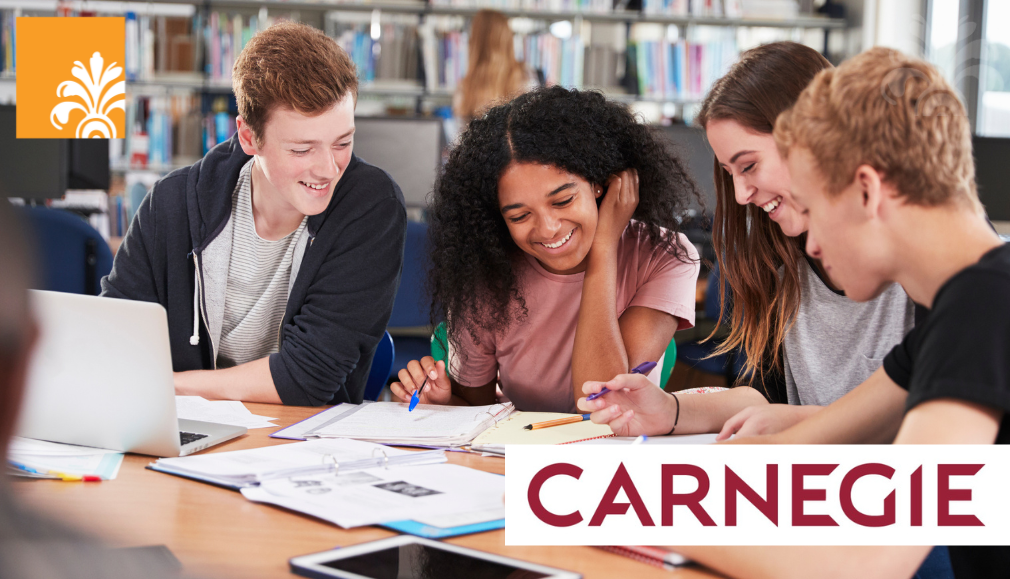 Four smiling students sit at a table in a library, studying and collaborating with notebooks and a laptop. The word “CARNEGIE” and a yellow decorative emblem highlight Carnegie’s legacy of academic excellence.