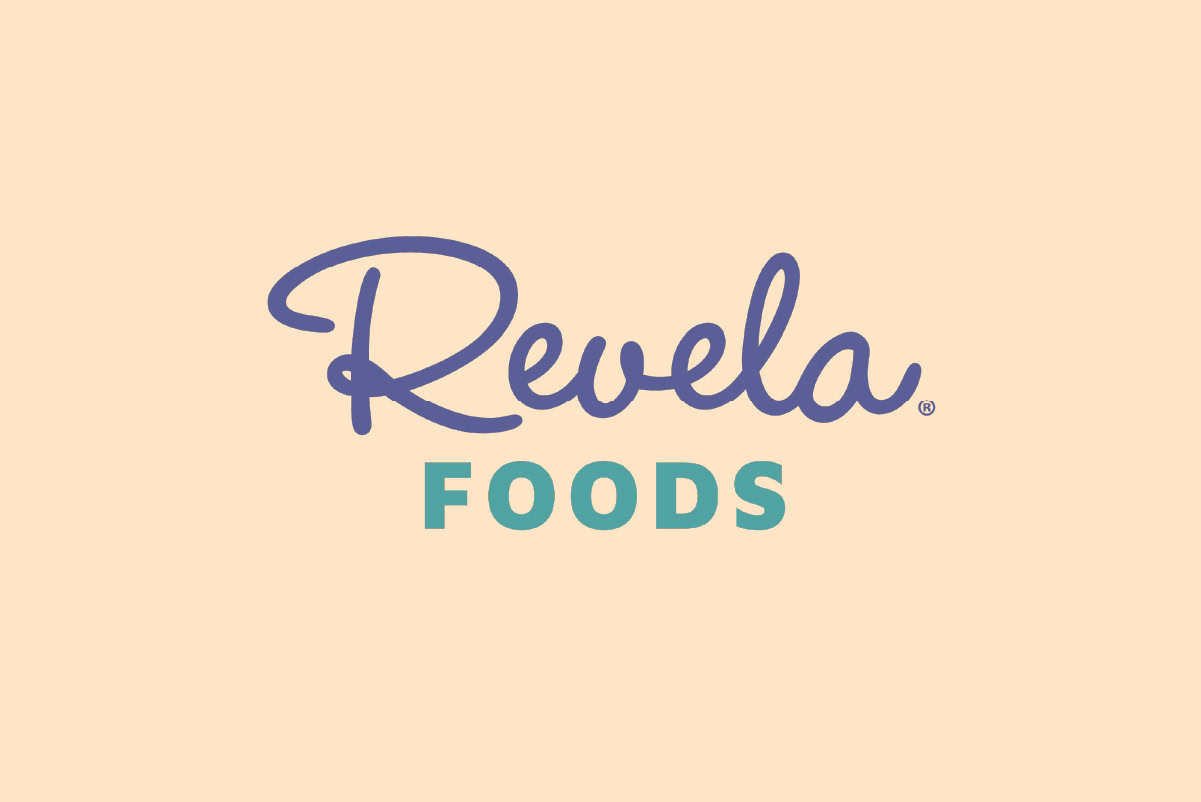 Revela Foods logo highlights the company rebrand with 'Revela' in purple script and 'FOODS' in bold teal on a light beige background, as seen at IFT FIRST.