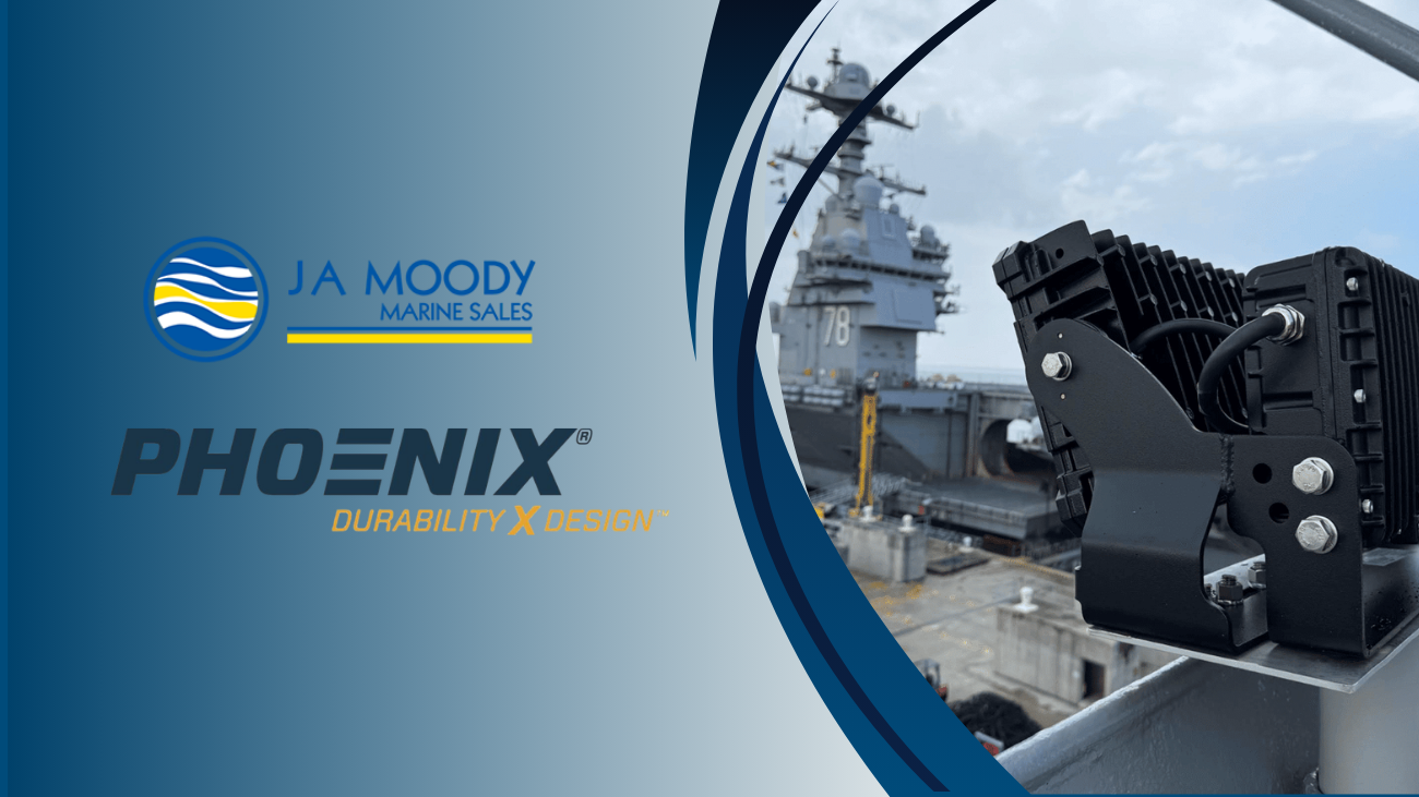 A JA Moody Marine Sales and Phoenix logo graphic appears next to a close-up of a mounted marine LED light fixture, with a naval ship visible in the background, highlighting a New Chapter in marine lighting solutions.